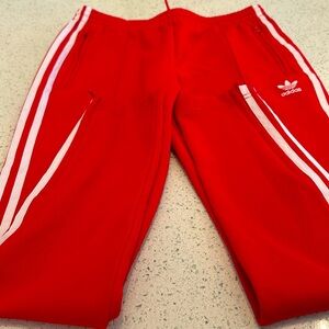 In good condition red adidas active wear